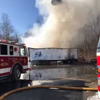 <p>Several tractor-trailers were on fire at a local plastics company.</p>