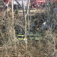 <p>Firefighters work to remove person killed during a crash on I-287.</p>