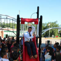 <p>Superintendent Joseph Ricca enjoys the playground on the first day of school.</p>