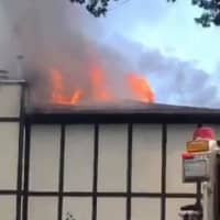 <p>Flames blew through the roof.</p>