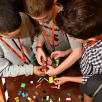 <p>Kids sharpen their engineering skills by building a LEGO carrier to test on a zip line.</p>