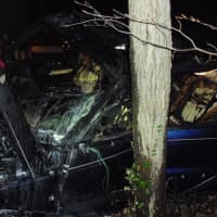 <p>Six Wilton Police officers pulled a man out of a car just moments before it was fully engulfed in flames on the night before Thanksgiving, police said.</p>
