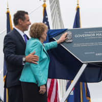 <p>Gov. Andrew Cuomo and his mother, Matilda Cuomo look over the plaque that bears his father&#x27;s name.</p>