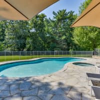 <p>A heated pool is just one of the many outdoor amenities of this five bedroom home in the Greens Farms section of Westport, Conn.</p>
