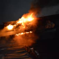 <p>Flames shooting from an apartment building at 52 Hampshire Street in Methuen</p>