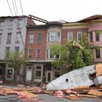 <p>A roof was torn off of a structure on Liberty Street between Washington Street and Grand Avenue in the City of Newburgh. The debris tore down power lines and knocked down a tree.</p>