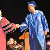 <p>A Dutchess Community College graduate receiving his degree on Thursday during commencement ceremonies.</p>