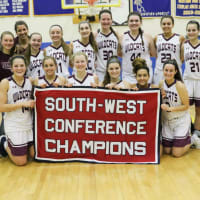 <p>The Bethel High School girls basketball team celebrates its first South-West Conference championship Wednesday night.</p>