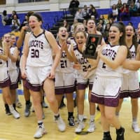 <p>The Bethel girls basketball team celebrates in front of fans after defeating New Fairfield for the SWC title.</p>