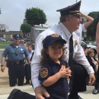 <p>Englewood Cliffs Police Chief Michael Cioffi with Alexandra, 6. &quot;She&#x27;s a little overwhelmed,&quot; mom Christina Theodorakos said. &quot;It&#x27;s a big crowd and event but she&#x27;s excited.&quot;</p>
