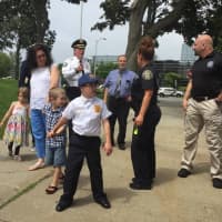 <p>A young chief takes the helm leading his family to the Bergen County Courthouse Friday.</p>