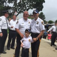 <p>Bergen County Sheriff Michael Saudino, left, with Saddle Brook Police Chief Robert Kugler and Chief for a Day Jake Erickson, 14.</p>