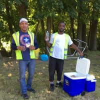 <p>Public workers help themselves to water in Charlie&#x27;s Cooler in New Milford.</p>