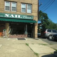 <p>One of three people in a car that crashed into a nail salon on Teaneck Road just after noon Thursday was taken across the street to Holy Name Medical Center, police said.</p>