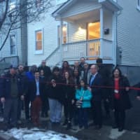 <p>Poughkeepsie Mayor Rob Rolison, Councilman Chris Petsas, and other officials attend the January ribbon-cutting and open house for 36 Gifford Ave., a renovation project the city hopes will spur further neighborhood improvements.</p>