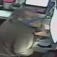 <p>Police investigators in Norwalk have released surveillance photos of the suspect implicated in an alleged robbery.</p>