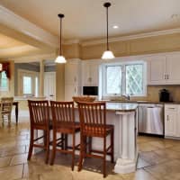 <p>The renovated kitchen has granite countertops and top-of-the-line appliances.</p>