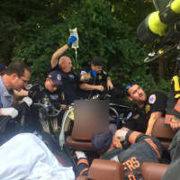 <p>First responders from multiple departments work together to save an injured person.</p>