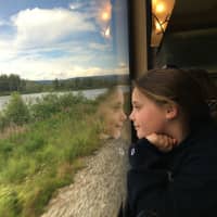 <p>Darien Arts Center Smartphone photo contest winner in the adult category of Travel, “Girl on a Train” by Elizabeth Fitzpatrick</p>