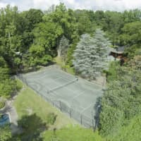 <p>A tennis court is just one of the amenities of this home.</p>