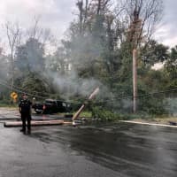 <p>Utility lines covered the road after a truck hit a utility pole.</p>