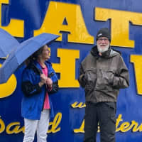 <p>Letterman and the winner in front of the sign.&nbsp;</p>
