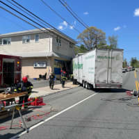 Tractor Trailer Slams Through Building In Three-Vehicle Crash: Cedar Grove PD