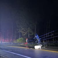 Car Rolls Over, Knocks Down Pole, Wires On Busy Westchester Road