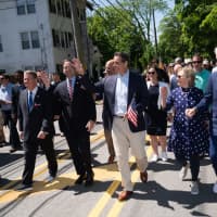 <p>Gov. Andrew M. Cuomo marches alongside former President Bill Clinton and former Secretary of State Hillary Clinton in the New Castle Memorial Day Parade on Monday, May 27.</p>