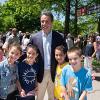 <p>Governor Andrew M. Cuomo marches alongside former President Bill Clinton and former Secretary of State Hillary Clinton in the New Castle Memorial Day Parade on Monday, May 27.</p>