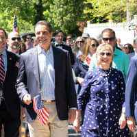 <p>Governor Andrew M. Cuomo marches alongside former President Bill Clinton and former Secretary of State Hillary Clinton in the New Castle Memorial Day Parade on Monday, May 27.</p>