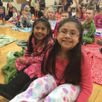 <p>Many dressed in comfortable pajamas, and toted favorite blankets and pillows to enjoy Bloomingdale&#x27;s PTA Family Reading Night</p>