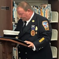 <p>Ridgefield Fire Chief Michael Kees at the library section dedication.</p>