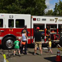 <p>Kids and adults alike check out fire trucks at Ridgefield Safety Day.</p>