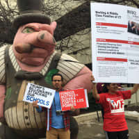 <p>Protesters from the Working Families Organization — and a pig — rally Saturday at the headquarters of AQR Capital in Greenwich. The three co-founders of the hedge fund made last week&#x27;s Forbes list of billionaires.</p>