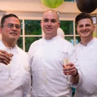 <p>Battle of the Chefs winner Beck Bolender (center) of One Twenty One with sous chefs Jess Laguerta (left) and David Fierstein (right)</p>