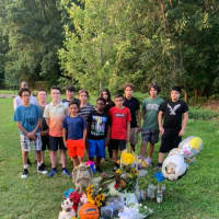<p>Children in Union meet at a makeshift memorial for Jeremy Maraj</p>