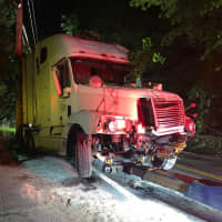 <p>A tractor-trailer spilled fuel on Clausland Mountain Road in Blauvelt after crashing off-road.</p>