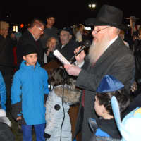 <p>Children sang during the menorah lighting ceremony in Wayne on Tuesday.</p>