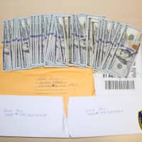 <p>Police officers in Ossining recovered thousands of dollars from two men believed to be operating a &quot;granny scam.&quot;</p>