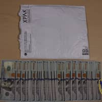 <p>Police officers in Ossining recovered thousands of dollars from two men believed to be operating a &quot;granny scam.&quot;</p>
