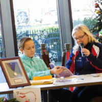 <p>U.S. Olympian Elaine Zayak and her son Jack read to the crowd at the Lodi Memorial Library Saturday.</p>