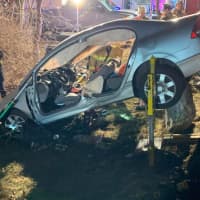 <p>Two people were trapped in a vehicle following a crash.</p>