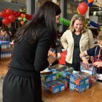 <p>Justin Marason, a 5th grader at Oradell Public School, helps create a snack pack to address child hunger.</p>