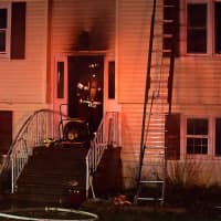 <p>Firefighters battle a fire at a Danbury home.</p>