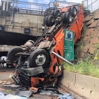 <p>The truck went off the Palisade Avenue overpass and landed nose-first on Route 495 in Weehawken.</p>