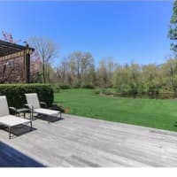 <p>The backyard is complete with a pond and huge property.</p>