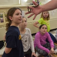 <p>Third graders get a close-up look at a baby Australian Carpet Python. Pictured left to right: Charlotte Ruhe, Brooke Dewbrey, Savanna Moore, Sophie Morrow and Aiden Coyne.</p>