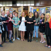 <p>Croton-Harmon High School’s AP Studio Art students, pictured here with teacher Jodi Burger, center, showcased their work during an art show in April.</p>