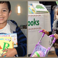 <p>A youngster happily displays his Dr. Seuss and Candy Land, and even little ones came to browse, at last year&#x27;s Holiday Toy Drive.</p>